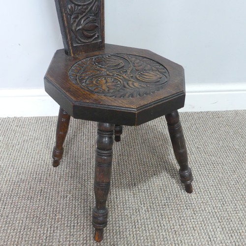 436 - An antique carved oak spinning Chair, pieced heart backrest, W 31 cm x H 95 cm x D 31 cm.... 