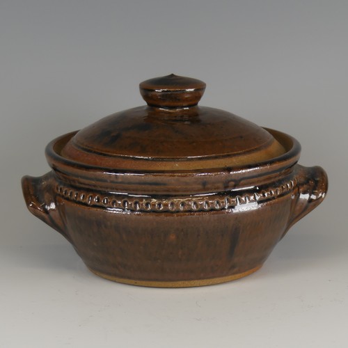 73 - Mike Dodd (b. 1943) a studio pottery Pot and Cover, with twin handles, decorated in a tenmoku glaze,... 