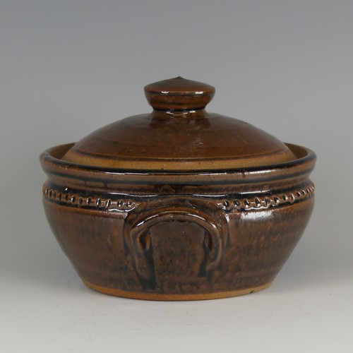 73 - Mike Dodd (b. 1943) a studio pottery Pot and Cover, with twin handles, decorated in a tenmoku glaze,... 