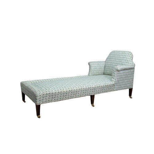 437 - A Howard and Sons mahogany upholstered Day Bed / Chaise Longue, raised on six tapering square legs a... 