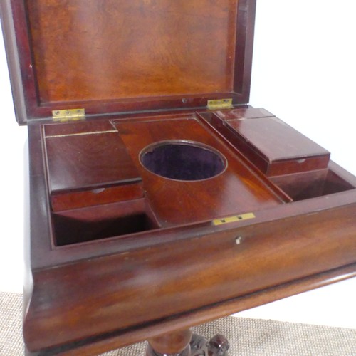 439 - A 19th century mahogany Teapoy, of sarcophagus form, hinged top concealing fitted interior, raised o... 