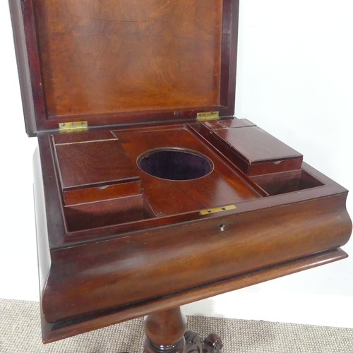 439 - A 19th century mahogany Teapoy, of sarcophagus form, hinged top concealing fitted interior, raised o... 