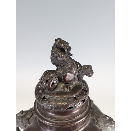 141 - A late 19th century Japanese bronze Censer, raised on three masked legs, with central pumpkin shaped... 