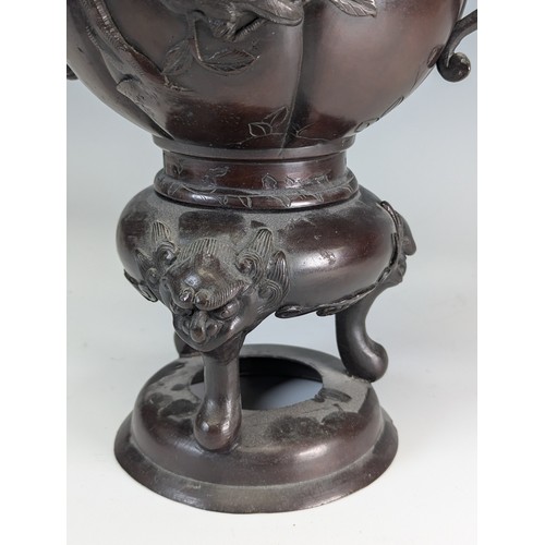 141 - A late 19th century Japanese bronze Censer, raised on three masked legs, with central pumpkin shaped... 