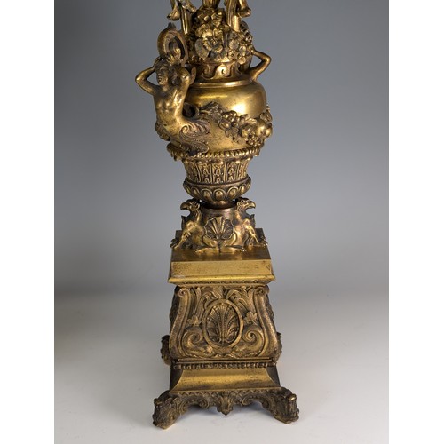 443 - A Pair of gilt metal four-branch Candelabra, in Louis XV style, with leaf-sheathed sockets and scrol... 