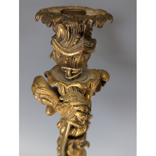 443 - A Pair of gilt metal four-branch Candelabra, in Louis XV style, with leaf-sheathed sockets and scrol... 