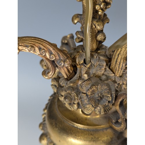 443 - A Pair of gilt metal four-branch Candelabra, in Louis XV style, with leaf-sheathed sockets and scrol... 