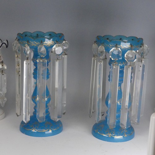 83 - A pair of Victorian opaque blue glass table Lustres, with gilt painted decorations and candlestick h... 