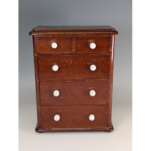 445 - An antique mahogany miniature / apprentice piece Chest of drawers, with ceramic handles, raised on b... 