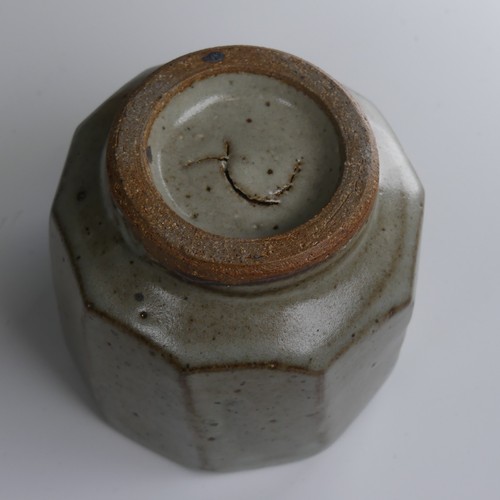 86 - A faceted studio pottery Yunomi, possibly Mike Dodd, in thick green ash glaze, marked to foot but un... 