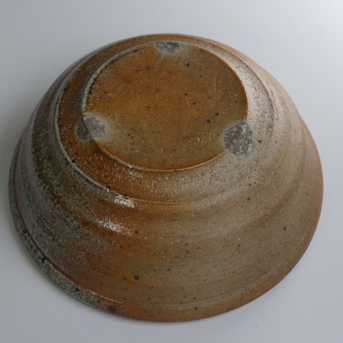 86 - A faceted studio pottery Yunomi, possibly Mike Dodd, in thick green ash glaze, marked to foot but un... 