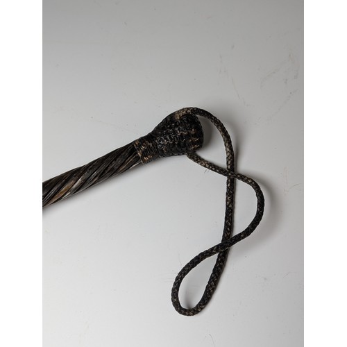 450 - A 19th century plaited and woven cord Life Preserver / Cosh, the twisted shaft connecting two bulbou... 