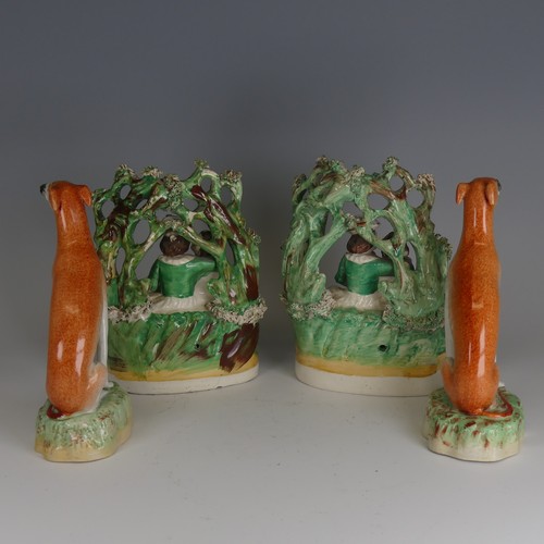 91 - A pair of antique Staffordshire porcelain Greyhounds, decorated in typical colours in seated positio... 