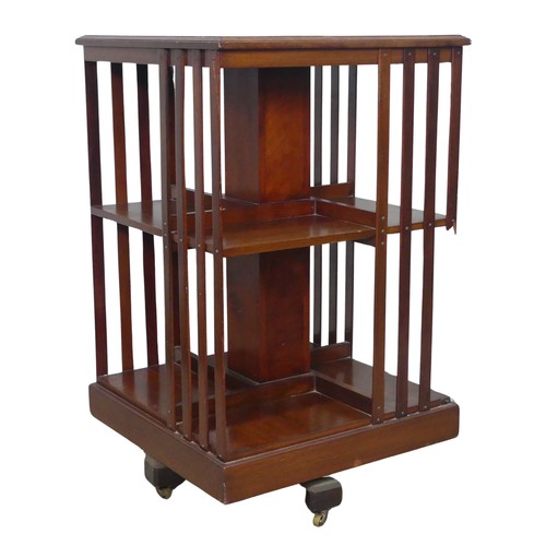 451 - An Edwardian mahogany revolving Bookcase, note one of the spindles is damaged, W 48.5 cm x H 78 cm x... 