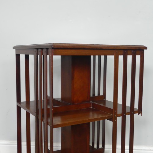 451 - An Edwardian mahogany revolving Bookcase, note one of the spindles is damaged, W 48.5 cm x H 78 cm x... 