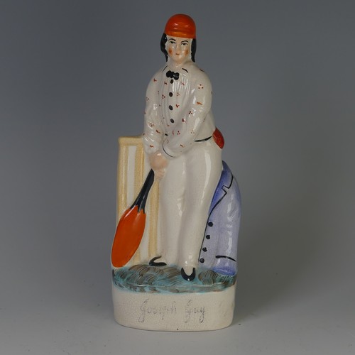 96 - An antique Staffordshire porcelain Figure of a seated Cat, decorated with sponged striped coat, with... 