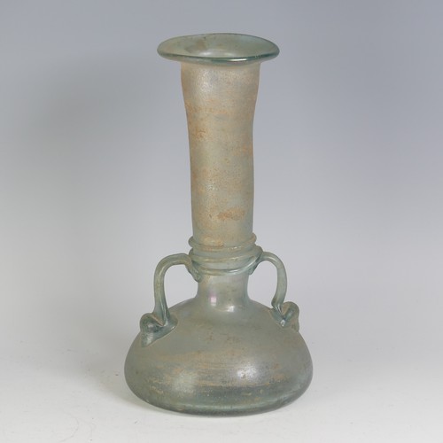 158 - A Roman green glass Vase, with pinched waist and bulbous flat base, flanked with twin-handles, with ... 