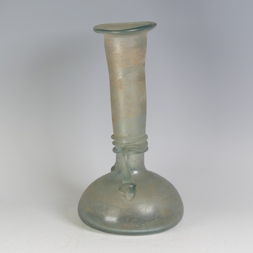 158 - A Roman green glass Vase, with pinched waist and bulbous flat base, flanked with twin-handles, with ... 