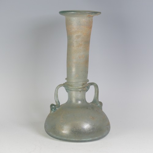 158 - A Roman green glass Vase, with pinched waist and bulbous flat base, flanked with twin-handles, with ... 