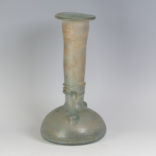 158 - A Roman green glass Vase, with pinched waist and bulbous flat base, flanked with twin-handles, with ... 