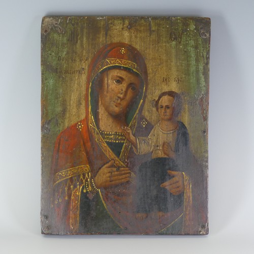 452 - A 19th century Russian School painted Icon, depicting the Guardian Angel flanked by saints and marty... 