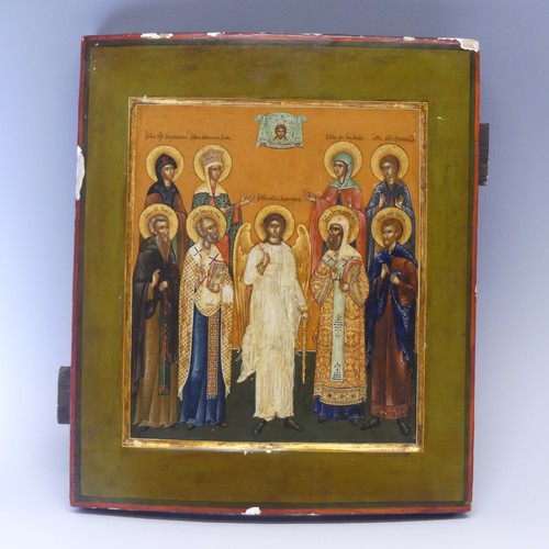 452 - A 19th century Russian School painted Icon, depicting the Guardian Angel flanked by saints and marty... 