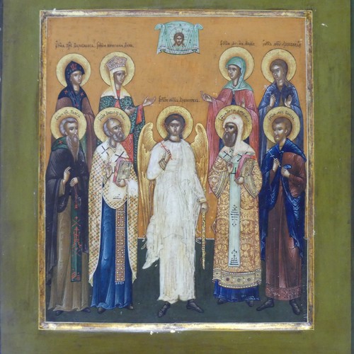 452 - A 19th century Russian School painted Icon, depicting the Guardian Angel flanked by saints and marty... 