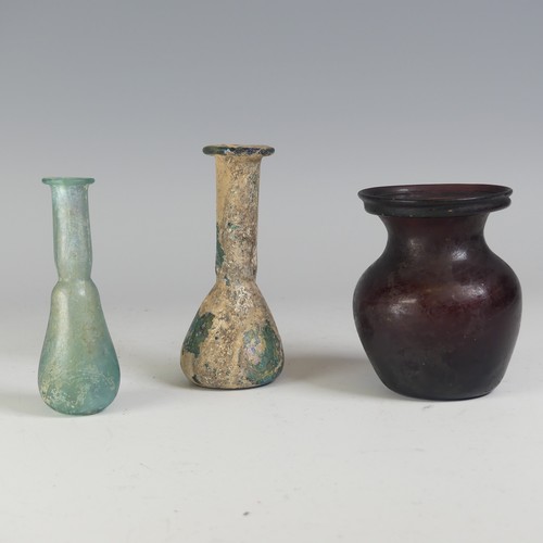 165 - A Roman aubergine glass Vase, of waisted globular form with flared rim, H 9cm, together with two Rom... 