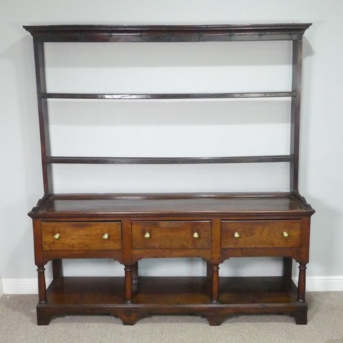 455 - A George III oak Dresser Base, with associated plate rack, the moulded cornice inset with hooks abov... 