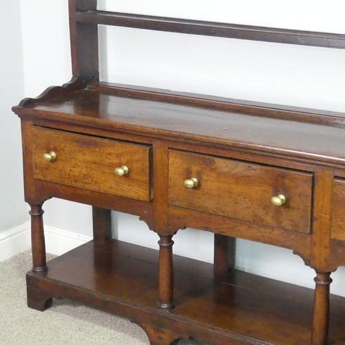 455 - A George III oak Dresser Base, with associated plate rack, the moulded cornice inset with hooks abov... 