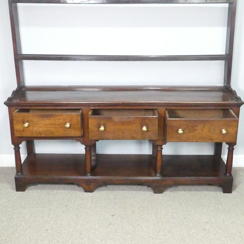 455 - A George III oak Dresser Base, with associated plate rack, the moulded cornice inset with hooks abov... 