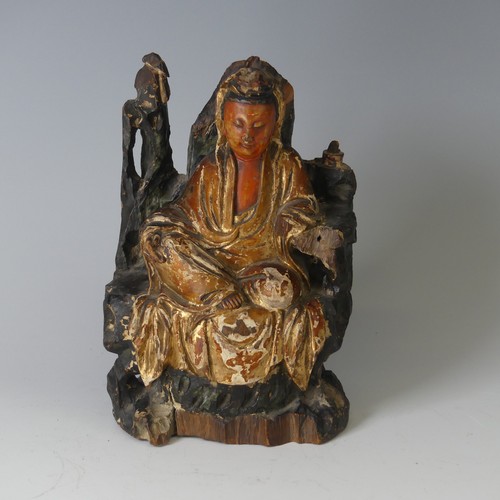 150 - An antique Chinese polychrome and gilt-lacquered wood figure of Guanyin, possibly Qing dynasty, seat... 