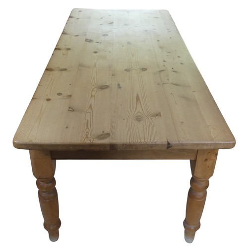 459 - A 20th century pine farmhouse kitchen Table, rounded rectangular top raised on turned supports, W 21... 