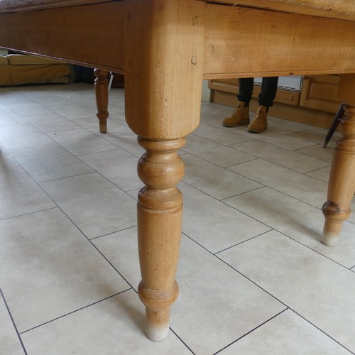 459 - A 20th century pine farmhouse kitchen Table, rounded rectangular top raised on turned supports, W 21... 