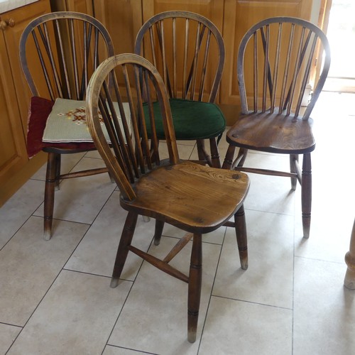 460 - A set of four antique ash and elm kitchen Chairs, stick backs above moulded seats and raised on turn... 