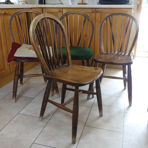 460 - A set of four antique ash and elm kitchen Chairs, stick backs above moulded seats and raised on turn... 