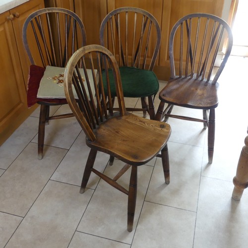 460 - A set of four antique ash and elm kitchen Chairs, stick backs above moulded seats and raised on turn... 