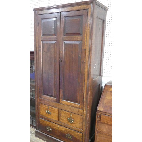 461 - A large 20th century oak panelled Cupboard, moulded cornice over two large panelled doors, concealin... 