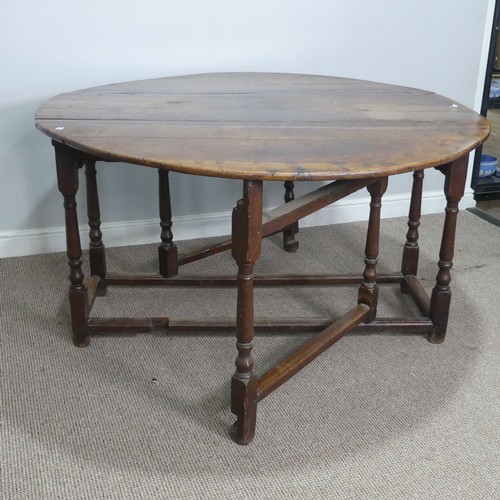 464 - An 18th century oak gateleg Table, with deep drawers to either end and raised on turned supports, W ... 