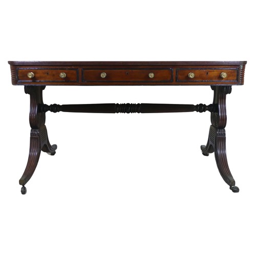 466 - A William IV mahogany and rosewood Library Table, the rectangular rounded top with rosewood banding,... 