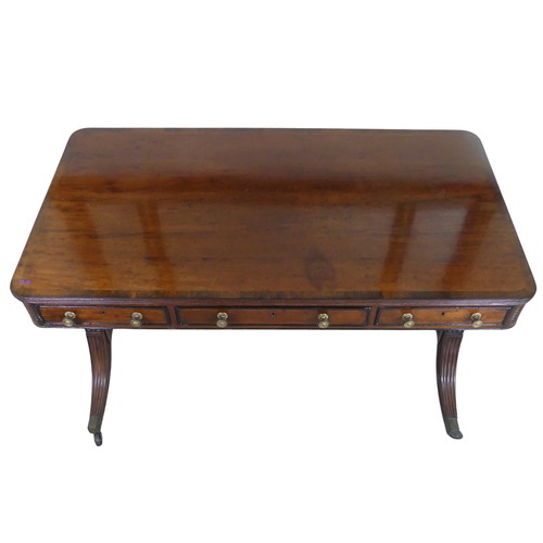 466 - A William IV mahogany and rosewood Library Table, the rectangular rounded top with rosewood banding,... 