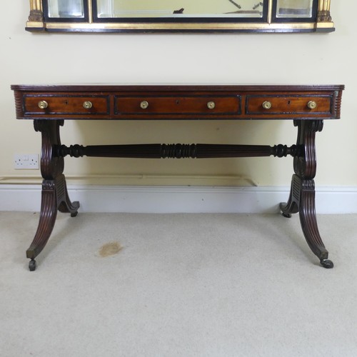 466 - A William IV mahogany and rosewood Library Table, the rectangular rounded top with rosewood banding,... 