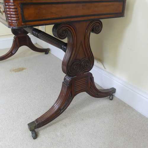 466 - A William IV mahogany and rosewood Library Table, the rectangular rounded top with rosewood banding,... 