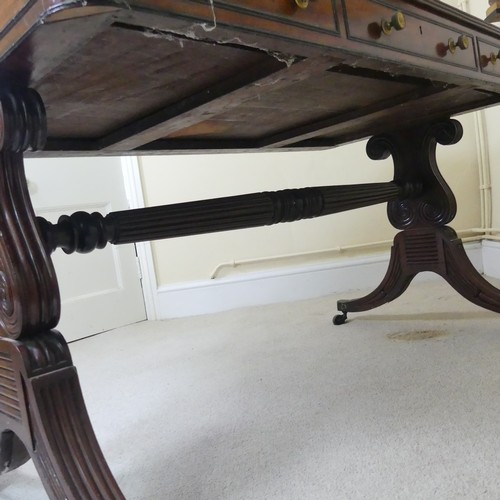 466 - A William IV mahogany and rosewood Library Table, the rectangular rounded top with rosewood banding,... 