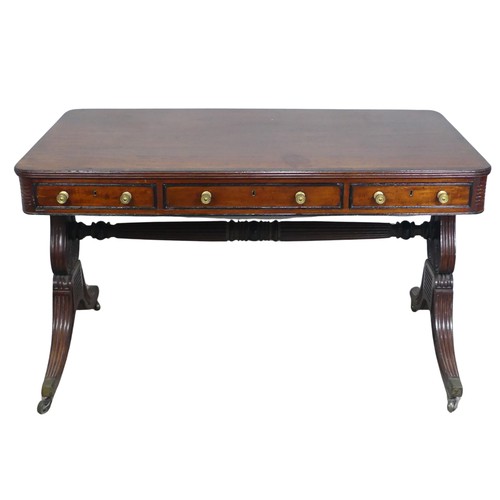 466 - A William IV mahogany and rosewood Library Table, the rectangular rounded top with rosewood banding,... 