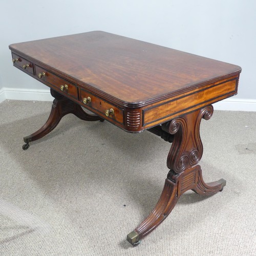 466 - A William IV mahogany and rosewood Library Table, the rectangular rounded top with rosewood banding,... 