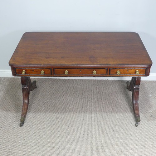 466 - A William IV mahogany and rosewood Library Table, the rectangular rounded top with rosewood banding,... 