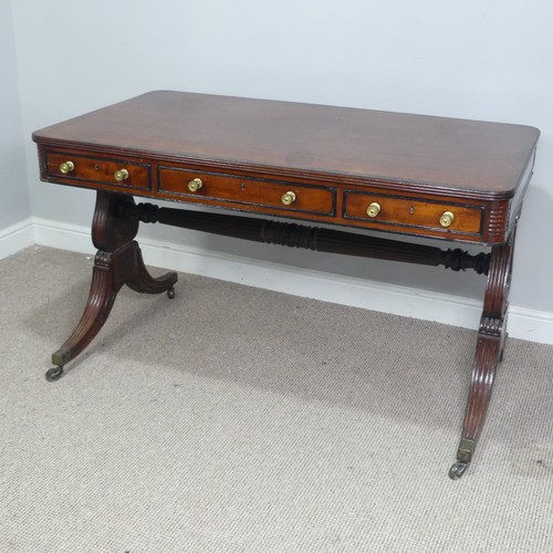 466 - A William IV mahogany and rosewood Library Table, the rectangular rounded top with rosewood banding,... 