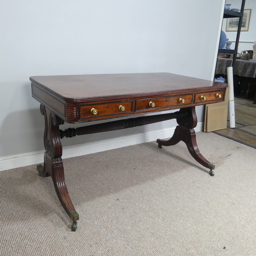 466 - A William IV mahogany and rosewood Library Table, the rectangular rounded top with rosewood banding,... 