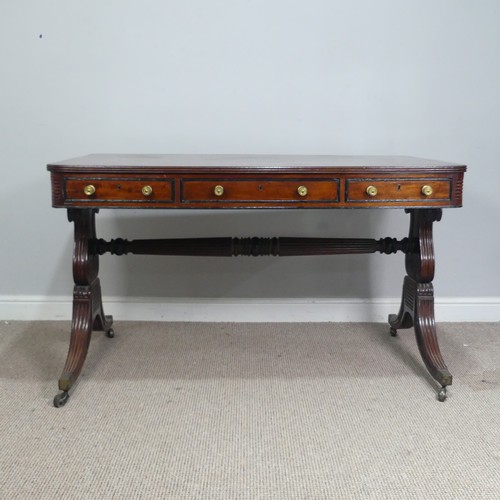 466 - A William IV mahogany and rosewood Library Table, the rectangular rounded top with rosewood banding,... 